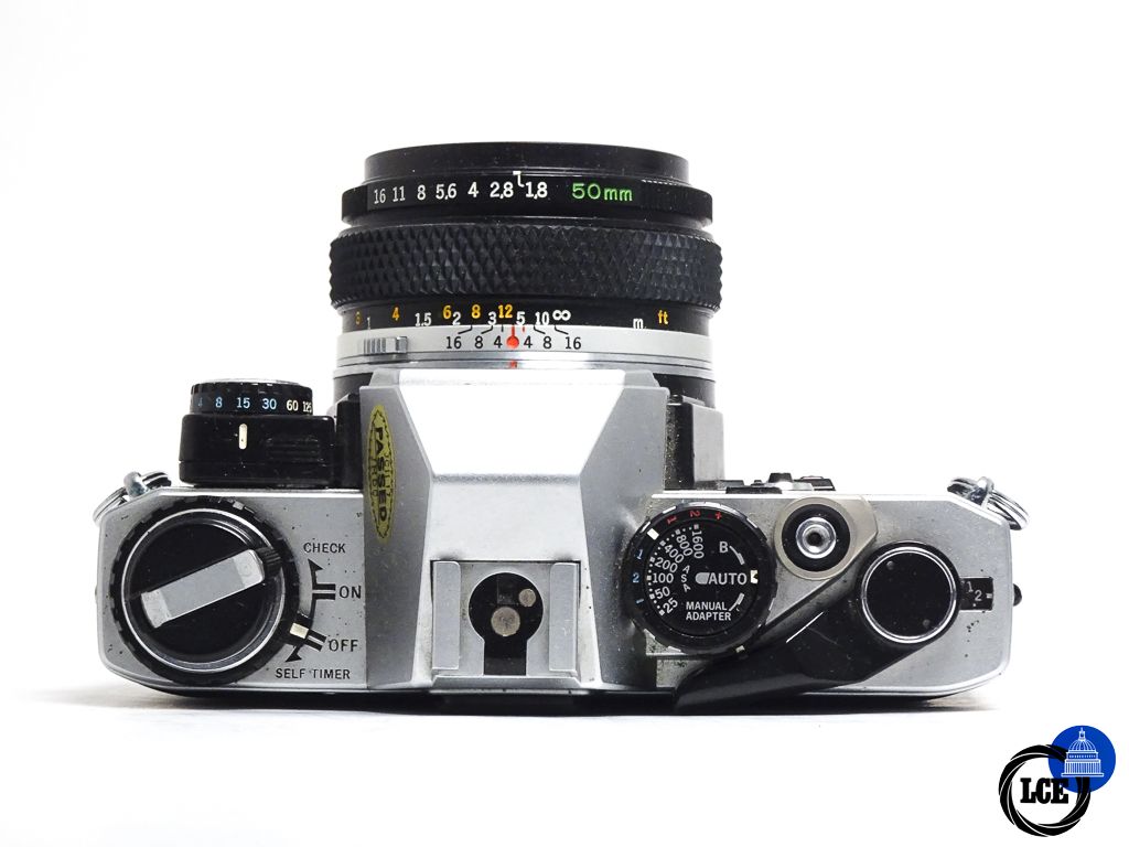 Olympus OM-10 + 50mm f1.8 + Manual Adapter