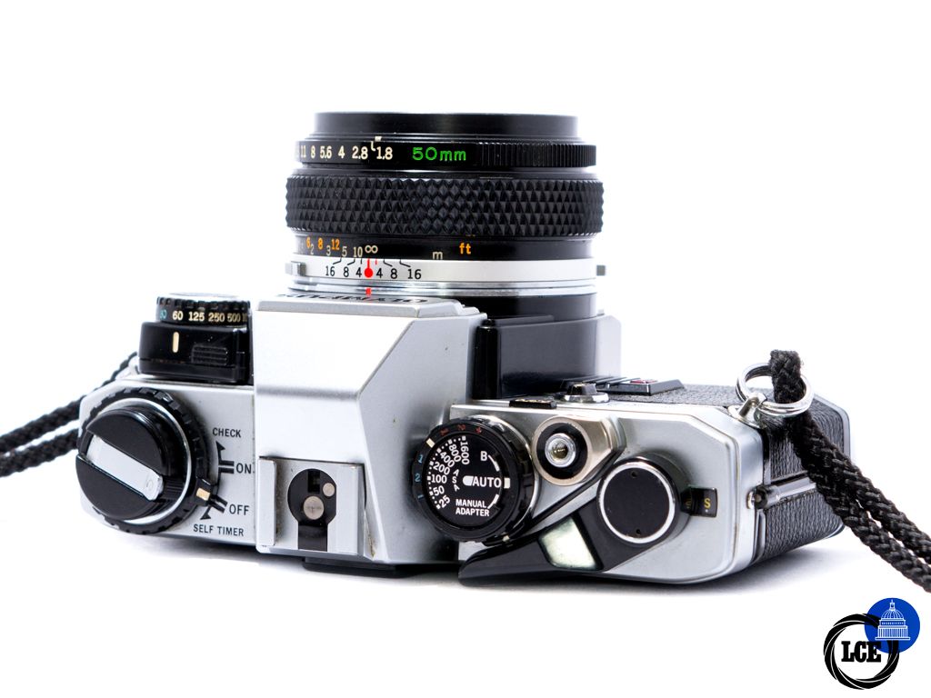 Olympus OM10 + 50mm f1.8 + Hunter strap + Manual Adapter
