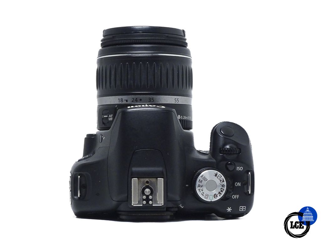 Canon 500D + 18-55mm f/3.5-5.6 II *light moisture*