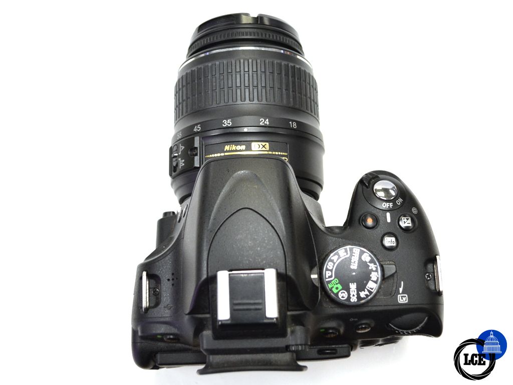 Nikon D5100 + 18-55mm