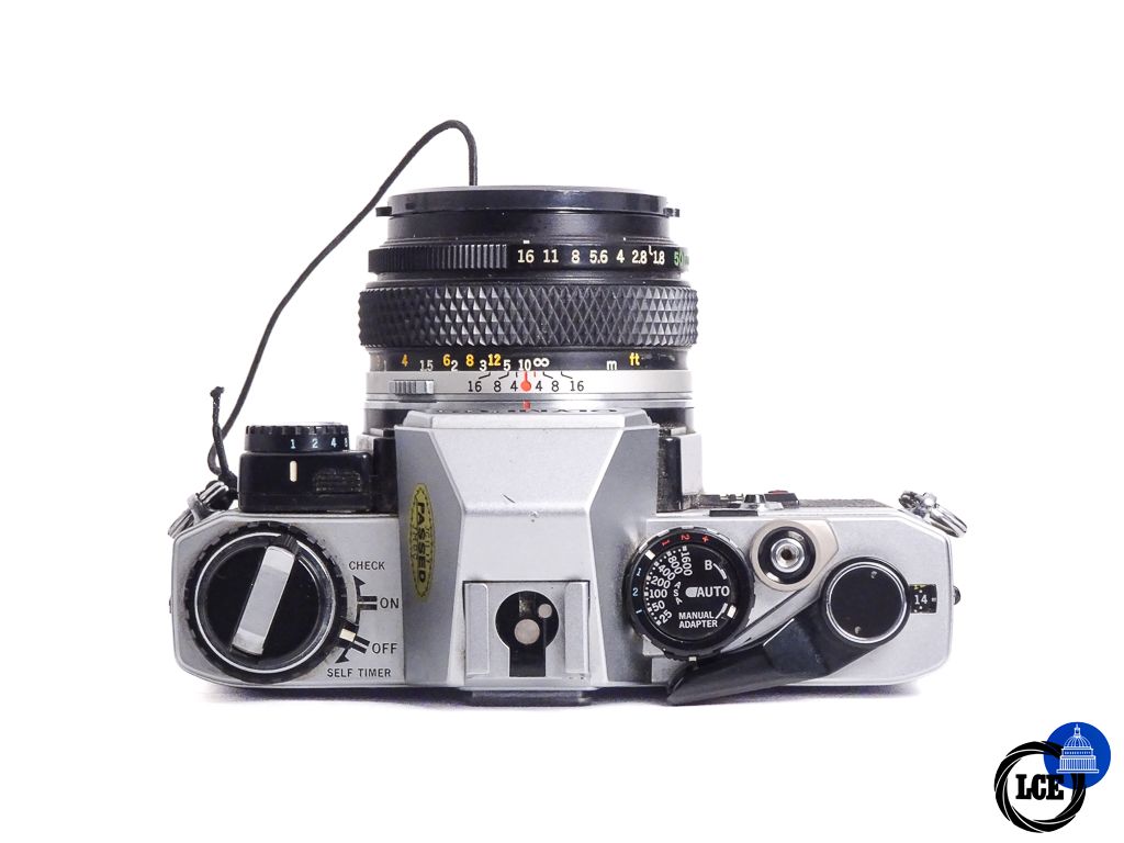 Olympus OM-10 + 50mm f1.8 + Manual Adapter 