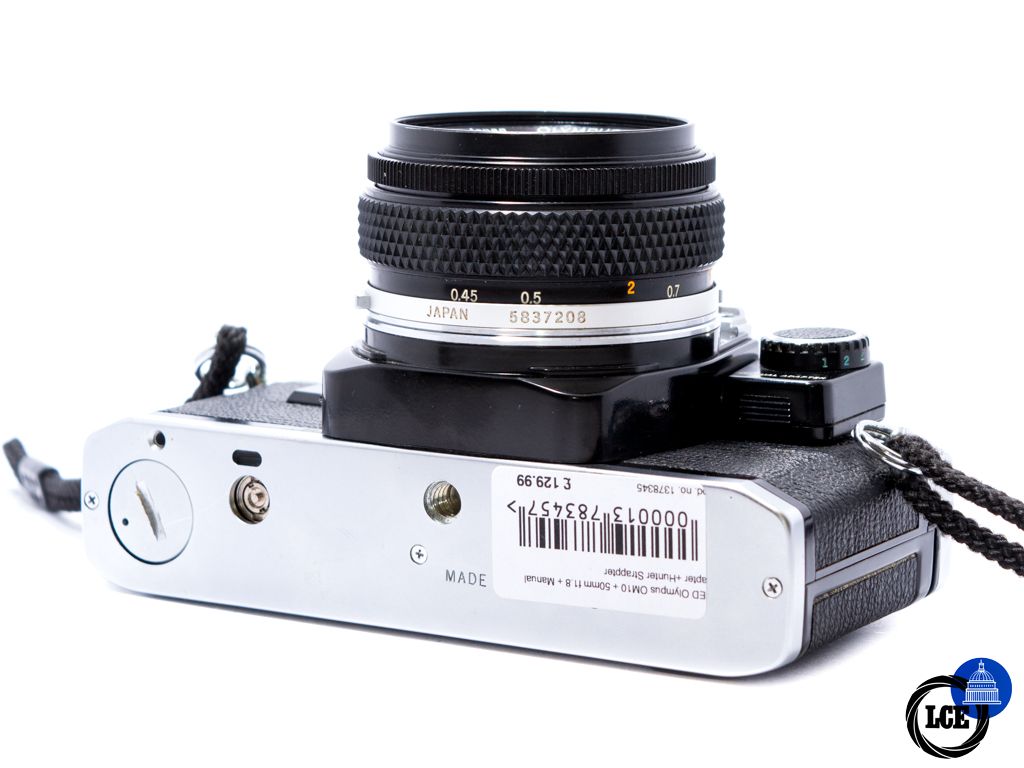 Olympus OM10 + 50mm f1.8 + Hunter strap + Manual Adapter